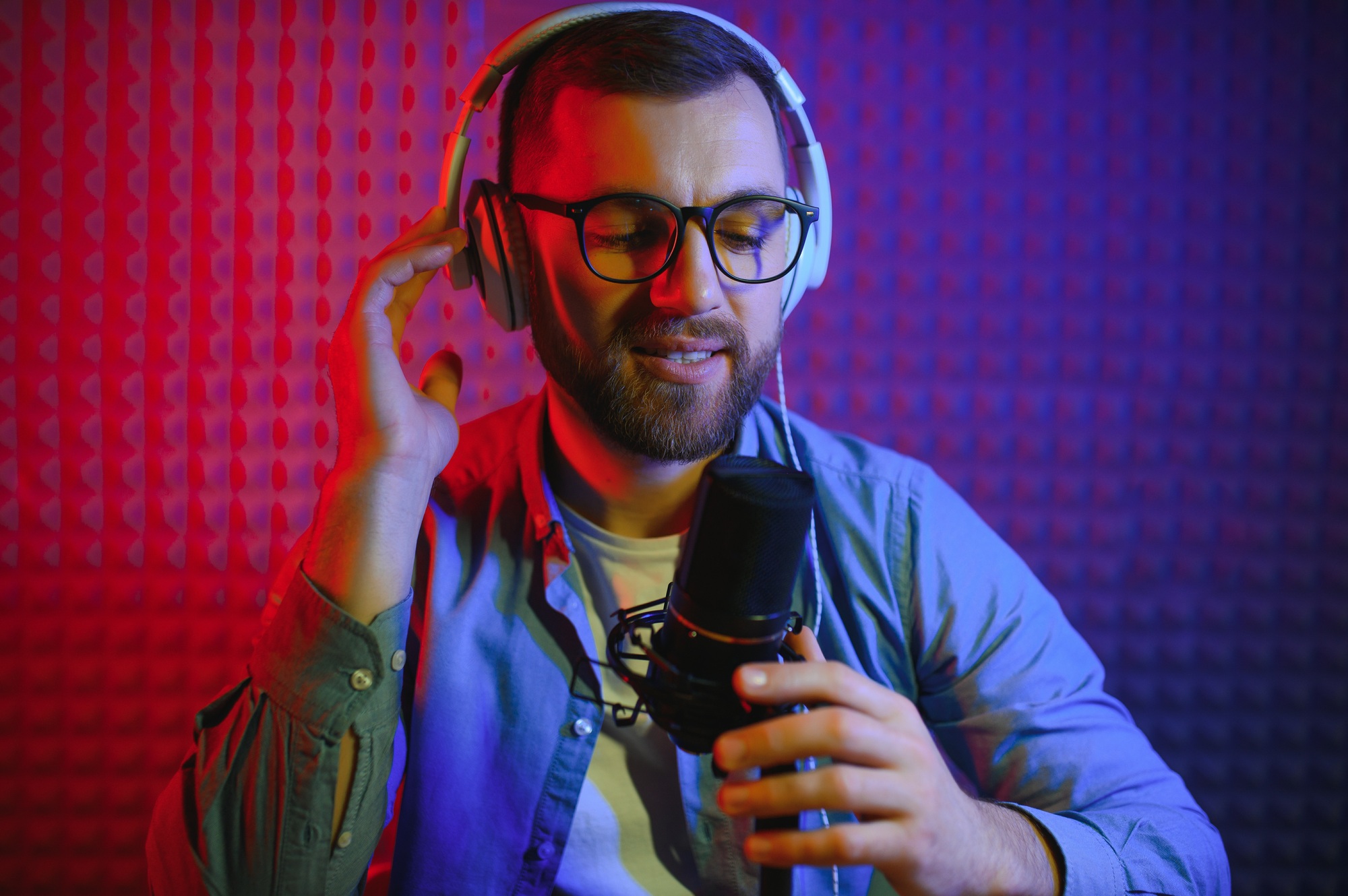 Man singing in a recording studio