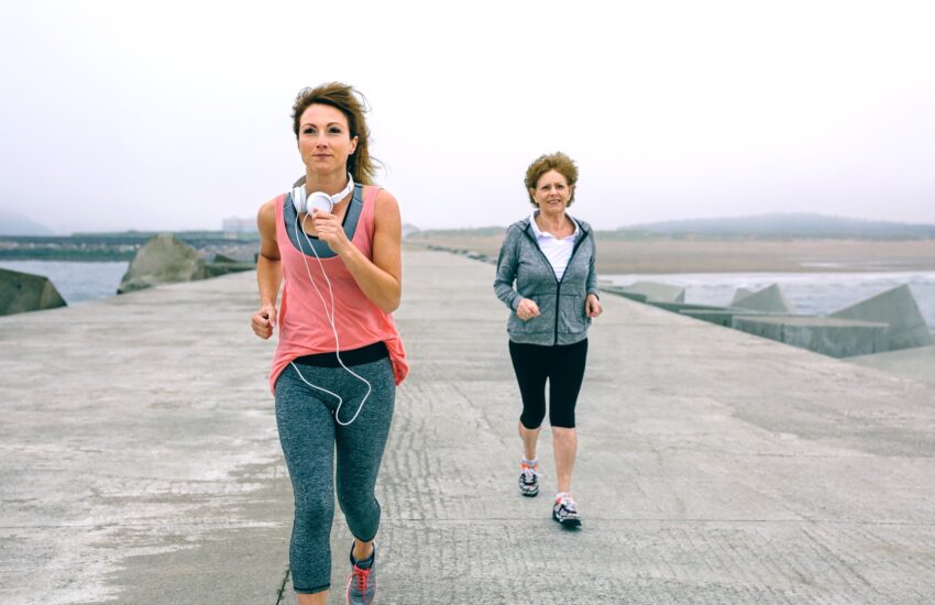 Senior and young sportswoman running